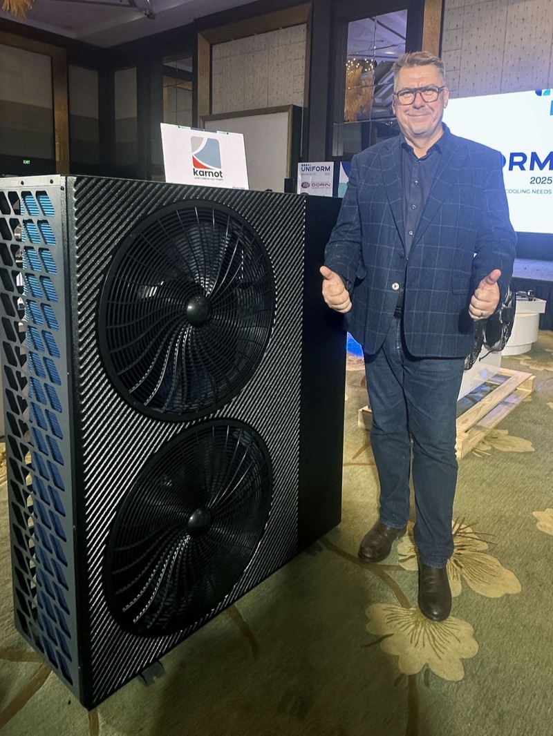 Stuart Cox, Founder and CEO of Karnot Energy Solutions, standing with an iHEAT heat pump