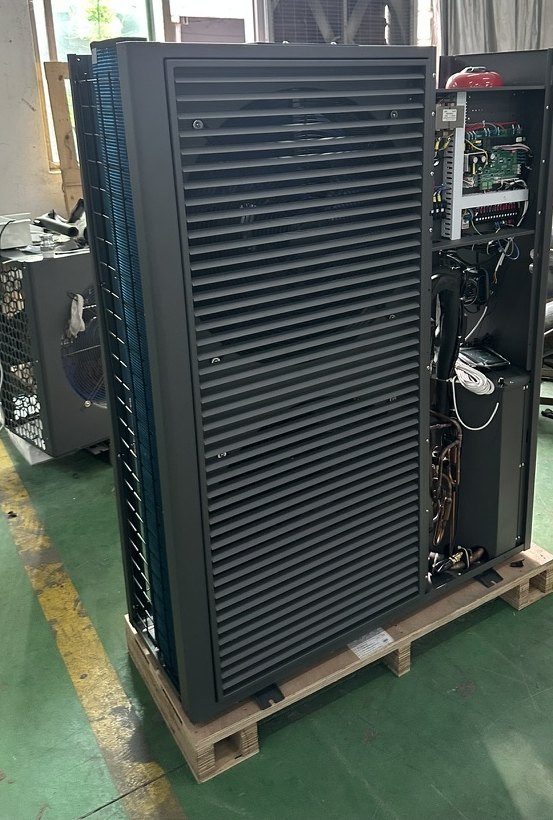 Louvred heat pump cabinet with the side panel off showing the control board and refrigerant circuit